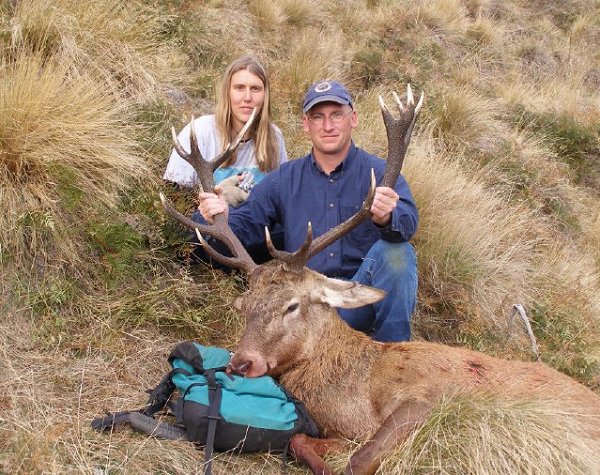 Scotty and Krystal with a red stag, hunting with Allan Kircher of NZ Backcountry Guides