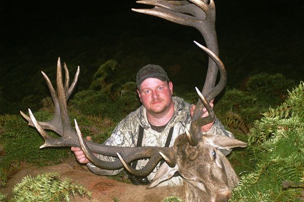 Cory Wright with his free range gold medal red stag, hunting at Glen Dene on the hills surrounding Lake Hawea